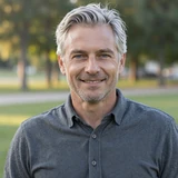 Steven, a 59-year-old Dremeet member from Florida with silver hair and a relaxed smile outdoors